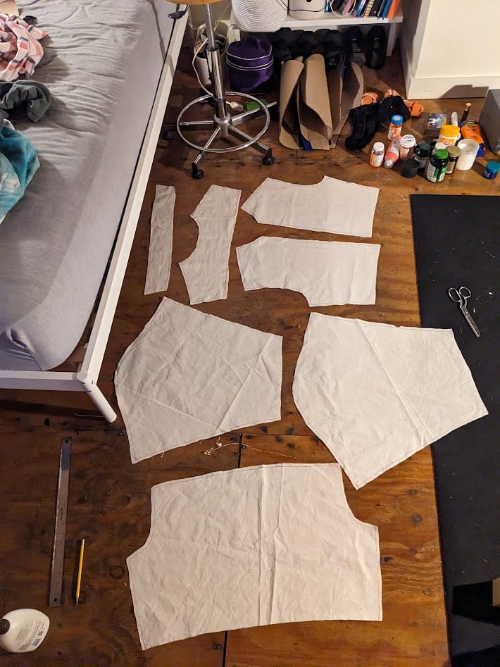 jacket pattern pieces cut out of muslin