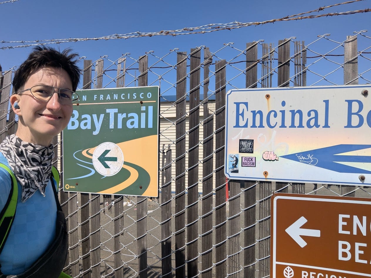 me in front of various signs about encinal beach and the bay trail