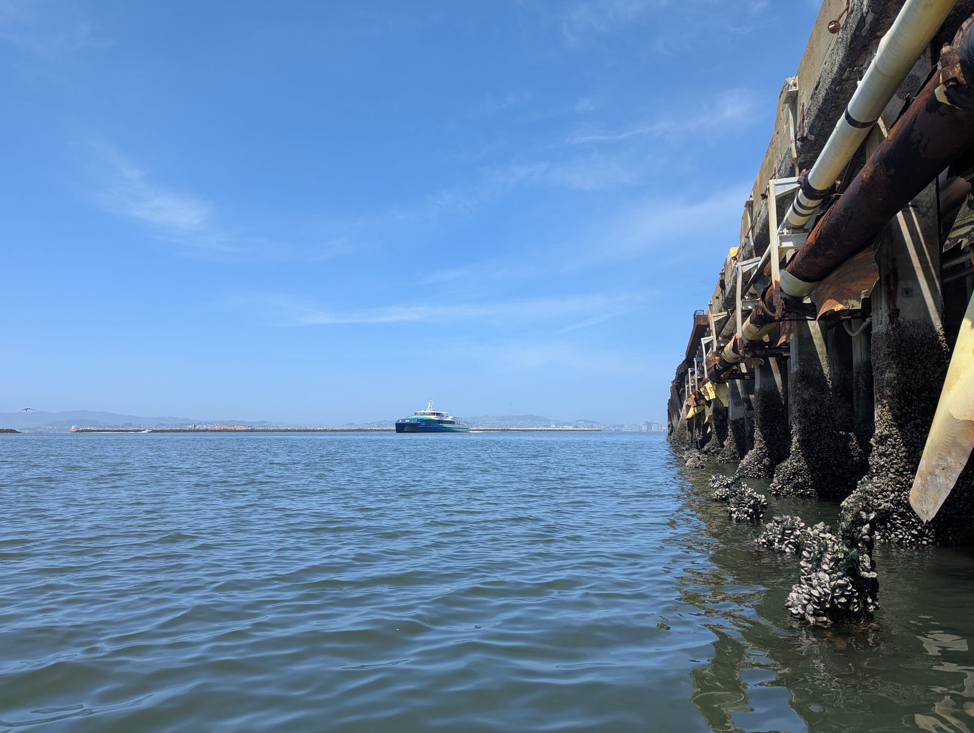 crusty ass pier, and an approaching ferry