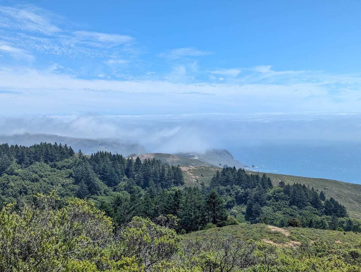 the marin headlands in the distance, covered in fog