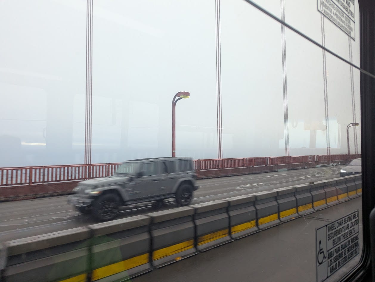 fog on the golden gate bridge, from a bus window