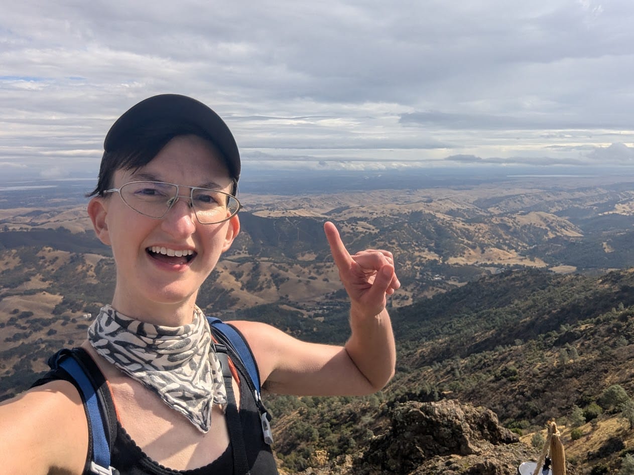 some fuckin nerd holding up 1 finger and grinning soyboyly