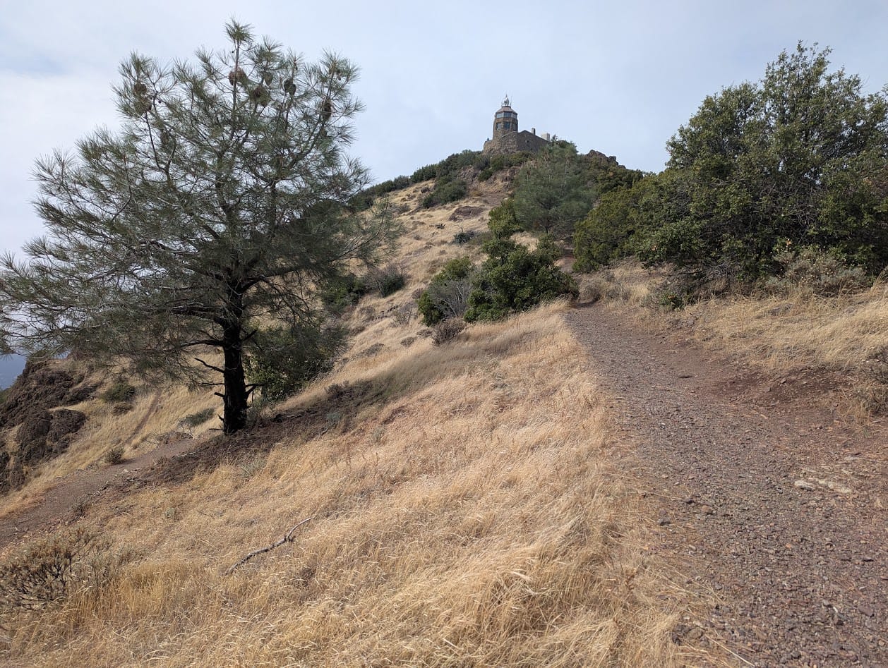 big steep hill leading up to a tower