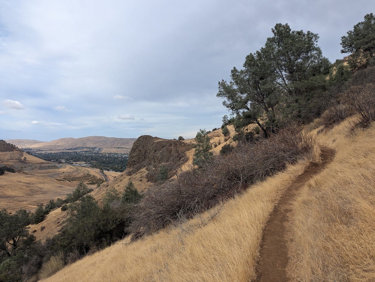 trail leading to a small rock formation that identifies as a peak