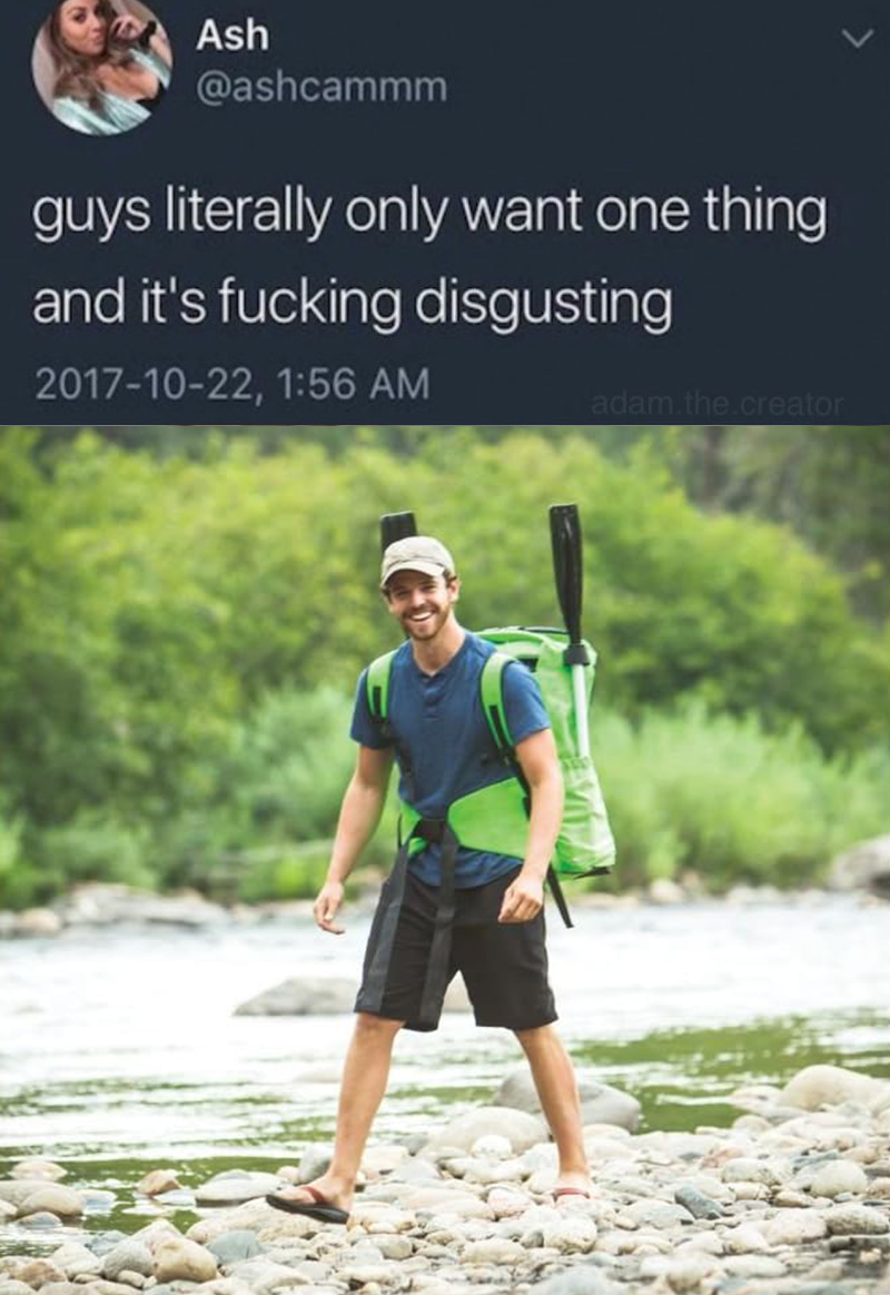 a guy walking through a creek with a giant green backpack like huge and extremely lime green. there are paddles sticking out